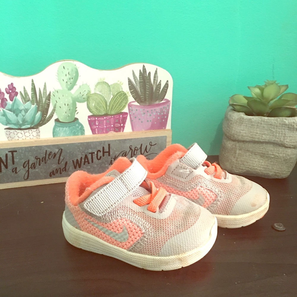 Infant Orange Nike’s size 3c.